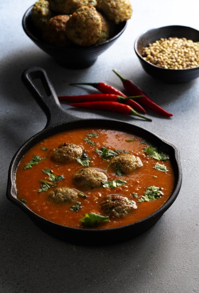 spicy red chicken meatballs curry photography